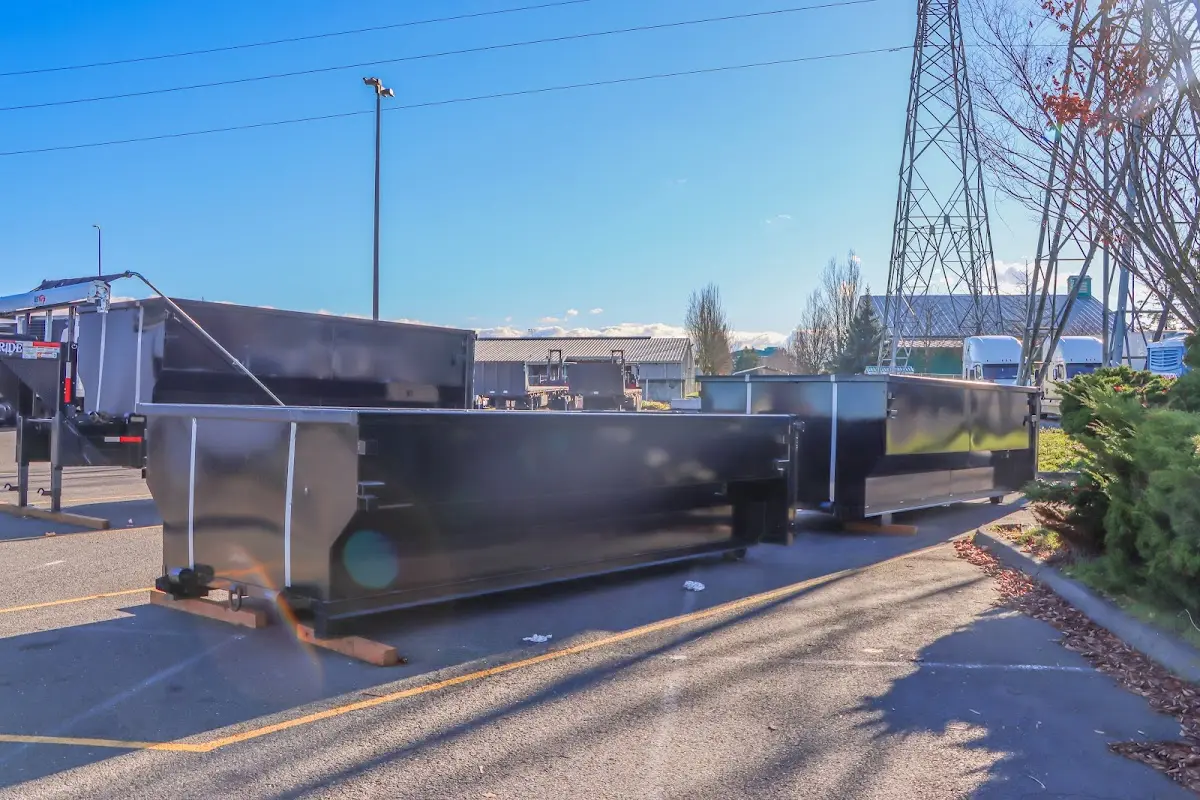 Roll-off dumpster ready for waste disposal at job site for Yard Waste Dumpster Rental in Terrytown